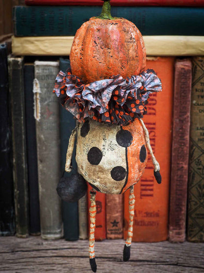 Danita Art thought about the Christmas carol story and decided to make a Halloween version with ghosts, ghouls, pumpkins, jack-o-lanterns, witches, cauldrons and more night creatures. This handmade art doll ornament for Christmas or Halloween trees is made with Spun cotton and paper clay,