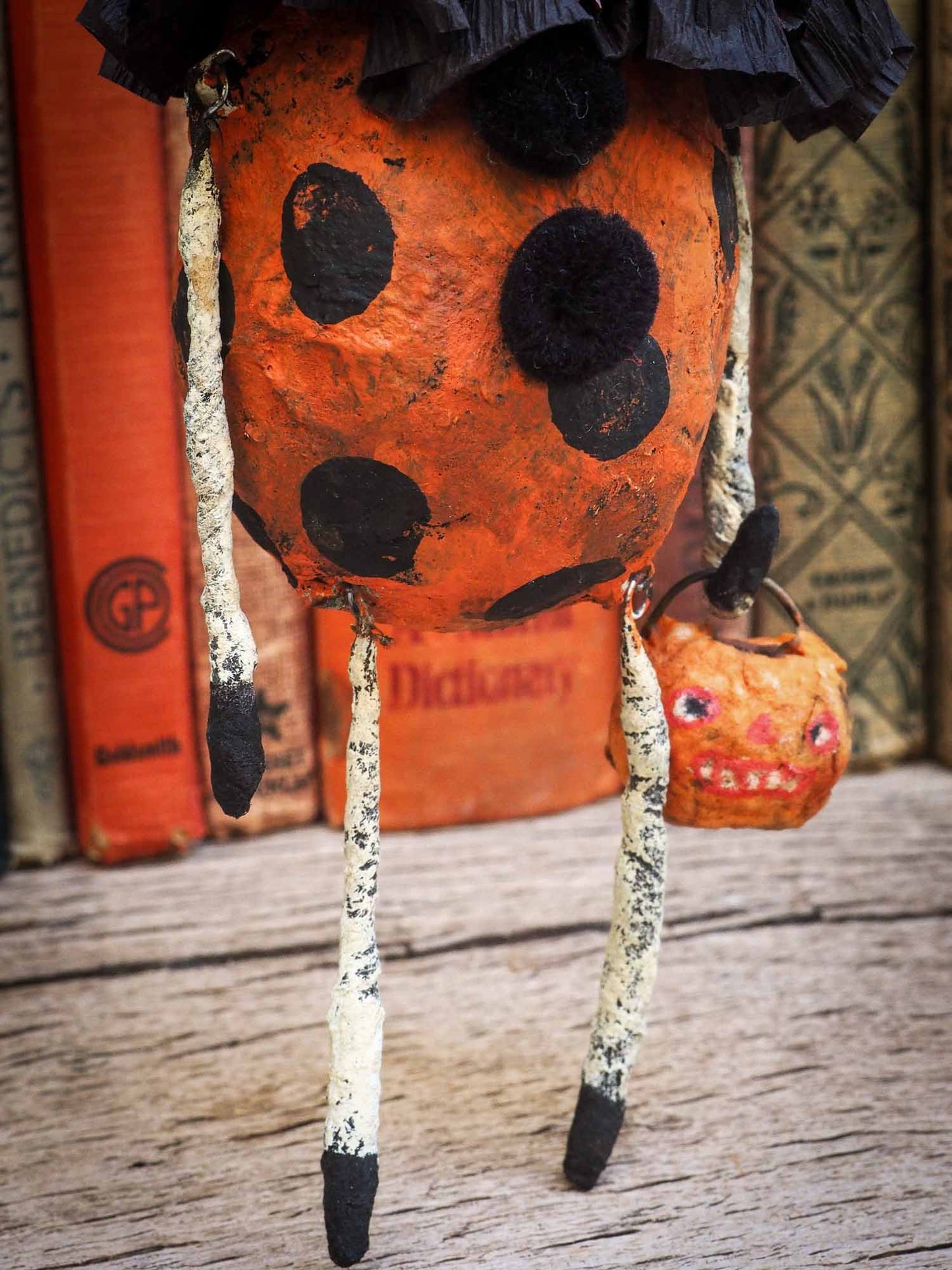 A Halloween carol is Danita's version of the tale of the three ghosts in A Christmas carol. Danita made handmade art dolls in spun cotton using ghouls, jack-o-lanterns, skeleton, witches, ghosts and more to create a visually inspiring set collection of Handmade dolls to create a beautiful Halloween story and home decor decoration.