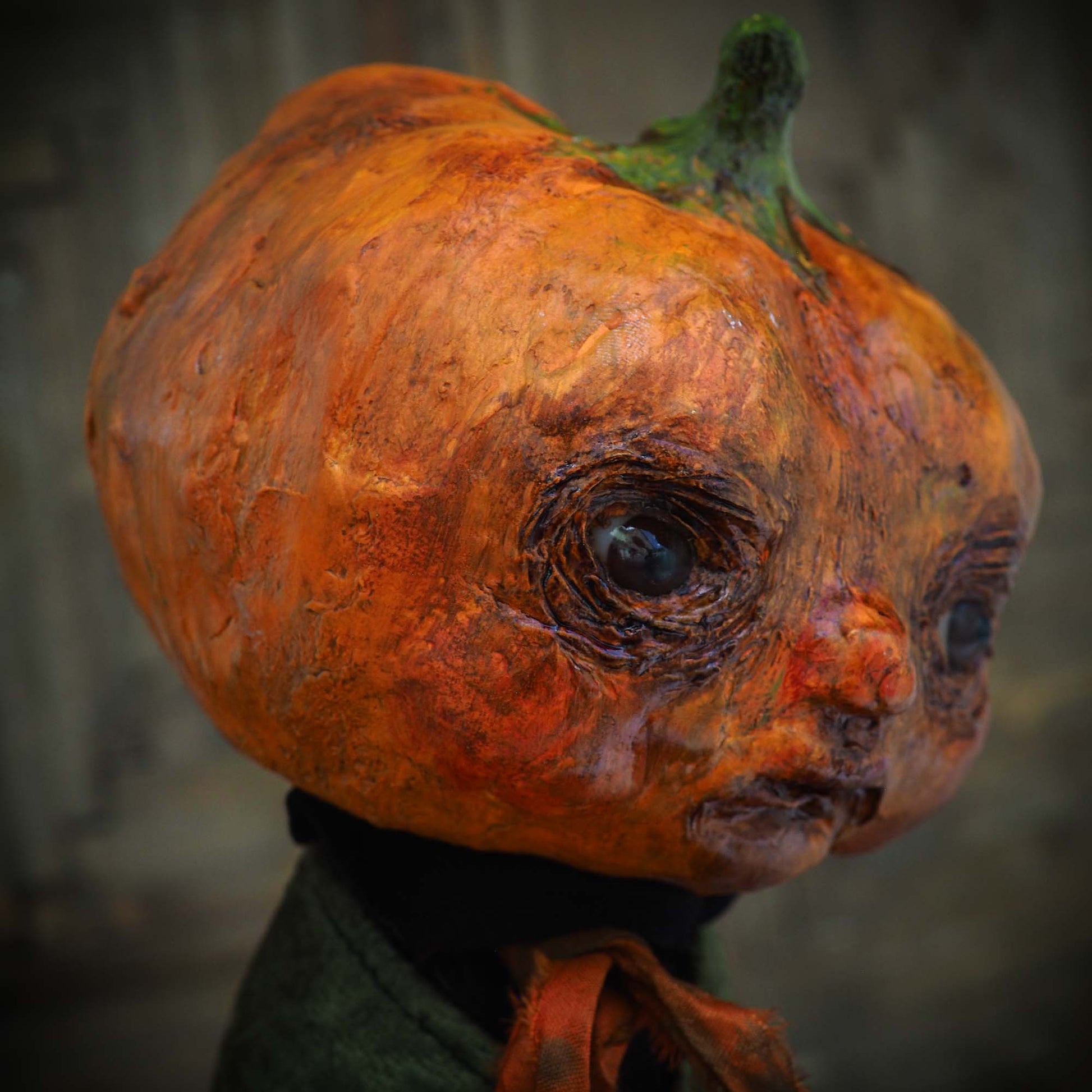 A witch transformed a boy into a Halloween pumpkin monster. This Danita original doll is a handmade jack-o-lantern soft sculpture as home decoration ornament. Carefully handmade with whimsical folk art roots, the spooky ghosts, witches, vampires, ghouls, and jack-o-lantern art dolls of Danita are full of mystery lore.