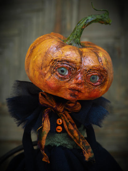 A witch transformed a girl into a Halloween pumpkin monster. This Danita original doll is a handmade jack-o-lantern soft sculpture as home decoration ornament. Carefully handmade with whimsical folk art roots, the spooky ghosts, witches, vampires, ghouls, and jack-o-lantern doll toys of Danita are full of mystery lore.