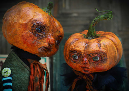 A witch transformed a girl into a Halloween pumpkin monster. This Danita original doll is a handmade jack-o-lantern soft sculpture as home decoration ornament. Carefully handmade with whimsical folk art roots, the spooky ghosts, witches, vampires, ghouls, and jack-o-lantern doll toys of Danita are full of mystery lore.