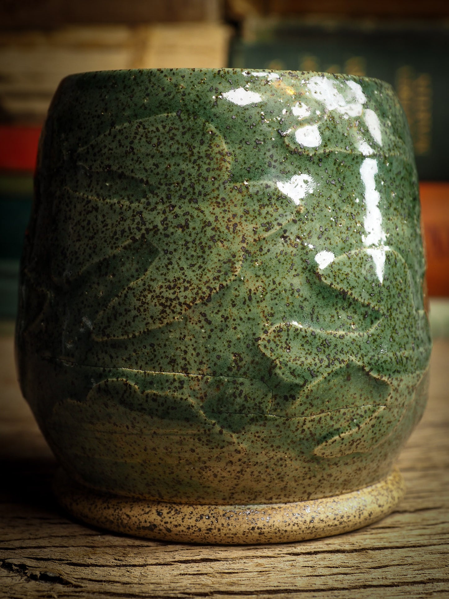 An original glazed ceramic jar by Idania Salcido, the artist behind Danita Art. It measures 2.5 x 2.5 x 3.5 Inches, with deep green hue glazes and hand decorated figures on the sides. Totally handmade in my studio, this is a unique piece that cannot be repeated. Food and drink safe, hand wash only.