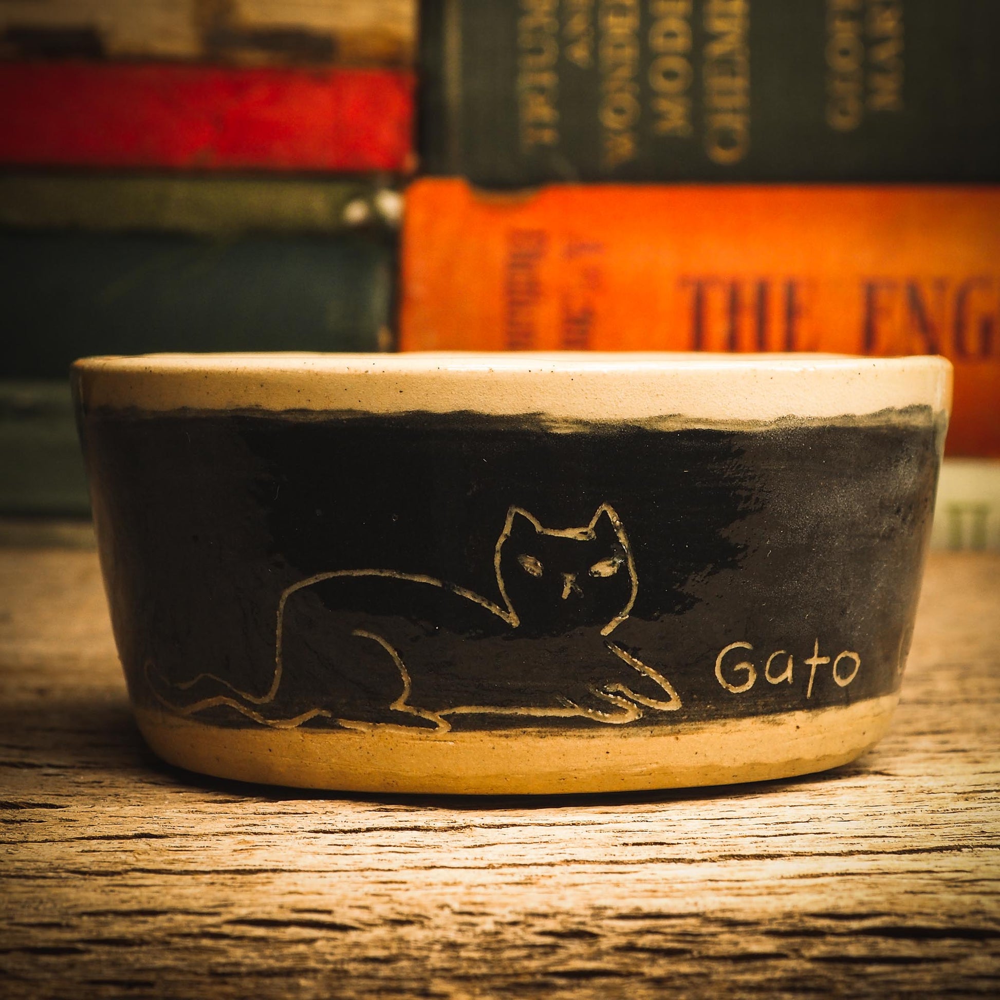 An original handmade fired stoneware ceramic art piece by Idania Salcido, the artist behind Danita Art. A Halloween themed bowl perfect for enjoying ice cream and fruit slices, or to be used as a fancy, one of a kind pet food bowl. Danita's exclusive line of housewares and hand made home decor will create beautiful memories for you.