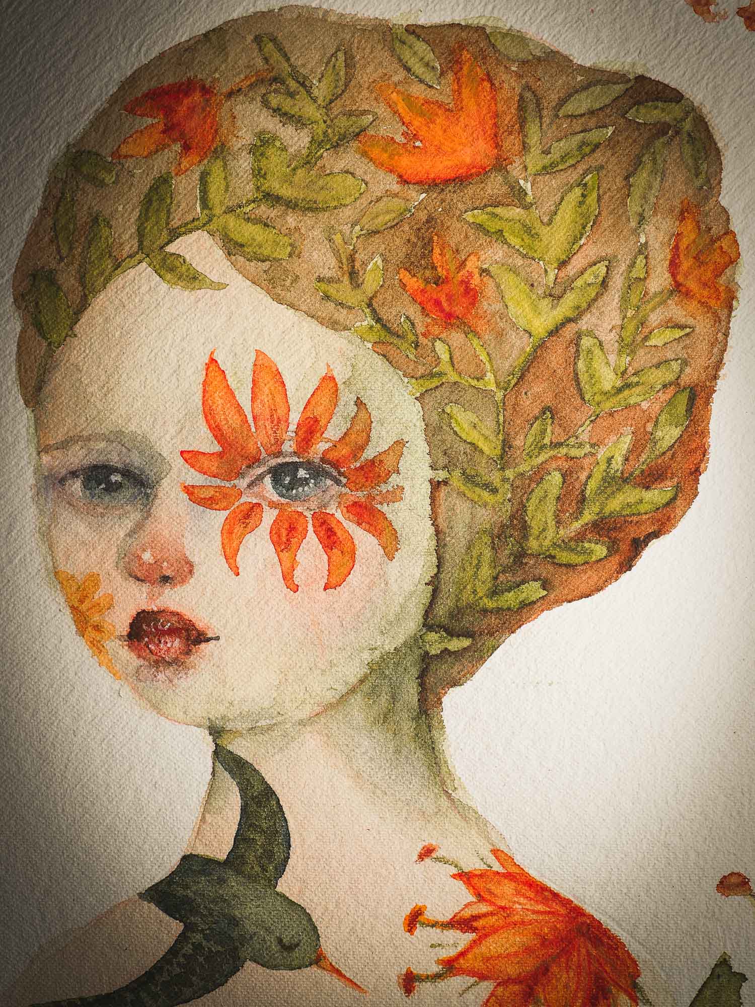 This original Idania Salcido (Danita Art) painting was made on a circular 12 x 12 Inch handmade watercolor paper, depicting a beautiful woman representing mother nature, with a wreath around it, orange flowers in her hair, a flower around her eye and a flying green bird at her shoulder.