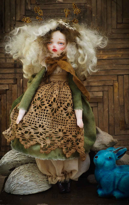 An original Danita handmade art doll, inspired by the sounds and smells of the Autumn forest, dry leaves and the colorful scenery of Mother Nature.  Her name is TERRA, goddess of the earth and home to all of us. She is dressed in a beautiful hand made green dress and a brown lace apron that represent the life giving power of earth and plants.