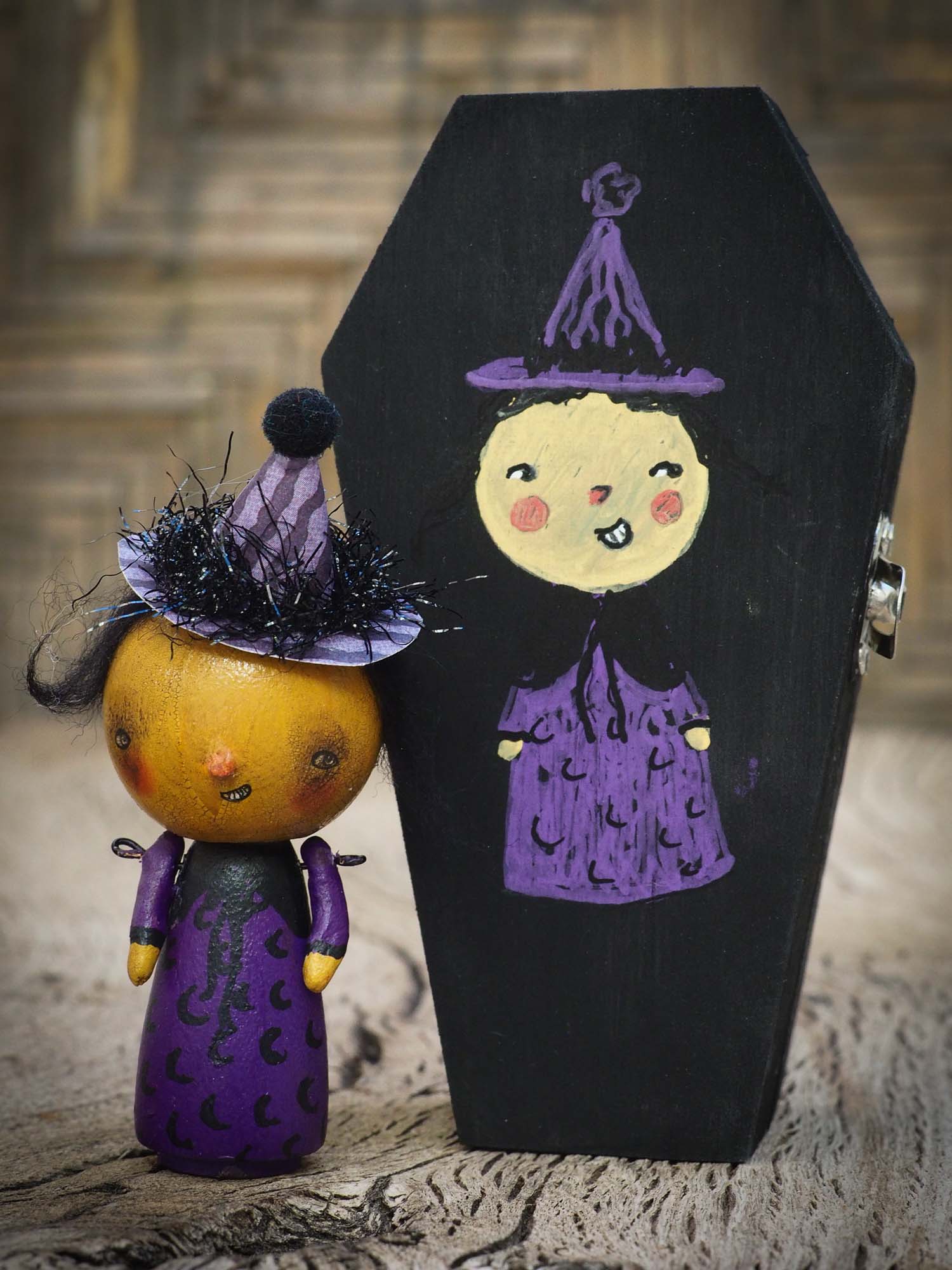 Folk art whimsical halloween witch mini kokeshi wooden style art dolls, designed and hand painted by non other that Danita Art, with painted body and wizard and witch clothes, adorable hand sculpted noses and a beautiful face with a whimsical smile. They come with a coffin shaped display and storage case for home decor