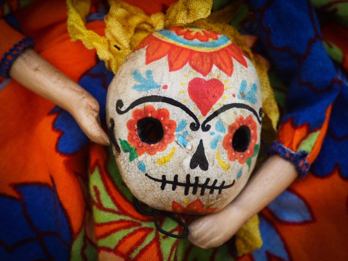 A beautiful handmade art doll by Danita, inspired by Mexican Folk art, Frida Kahlo and The Day Of the Dead. She wears a colorful native motif dress, an unmistakable unibrow, a colorful Dia De los Muertos Catrina skull mask and the signature amazing eyes of Danita Art.