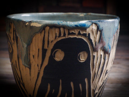An original Halloween ceramic mug tumbler bowl handmade by Idania Salcido the artist behind Danita Art. Made with wheel thrown clay hand carved and glazed by the artist. Witches, ghosts, goblins, black cats, vampires give a folk art primitive feel to it. Perfect for Halloween Candy, ice cream and fruit, a pet cat bowl.