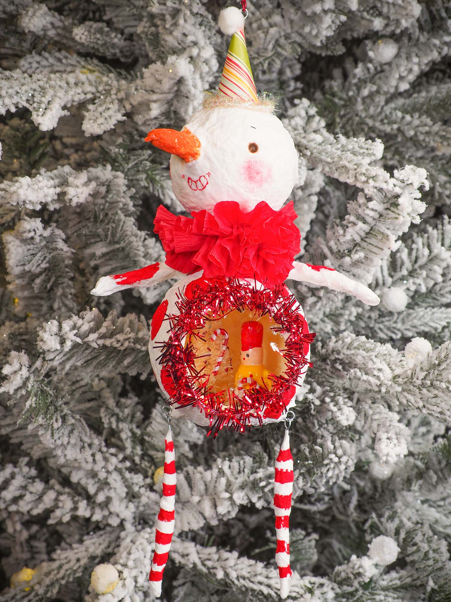 Adorable handmade spun cotton Art Doll Christmas tree ornament by Idania Salcido, the artist by Danita Art. Hand painted by the artist holiday figurine with paper hat with tinsel and vintage style garlands and a tiny Christmas tree. Hang this handmade ornament from your Christmas tree or use as Holiday decoration.