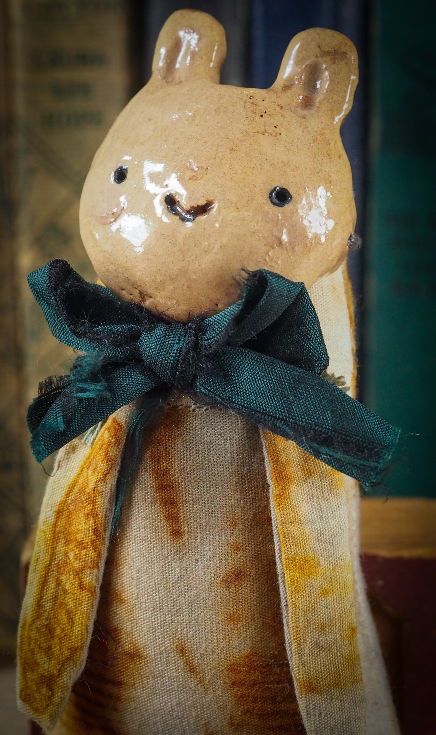 Soft sculpture art doll by Idania Salcido Danita Art with a Handmade ceramics face, organic dyed fabric and silk bow